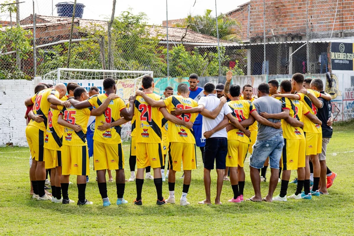 A coach with a junior team in a huddle